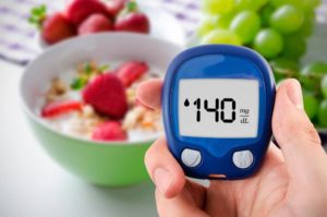 Blood glucose monitor displaying 140 mg/dl